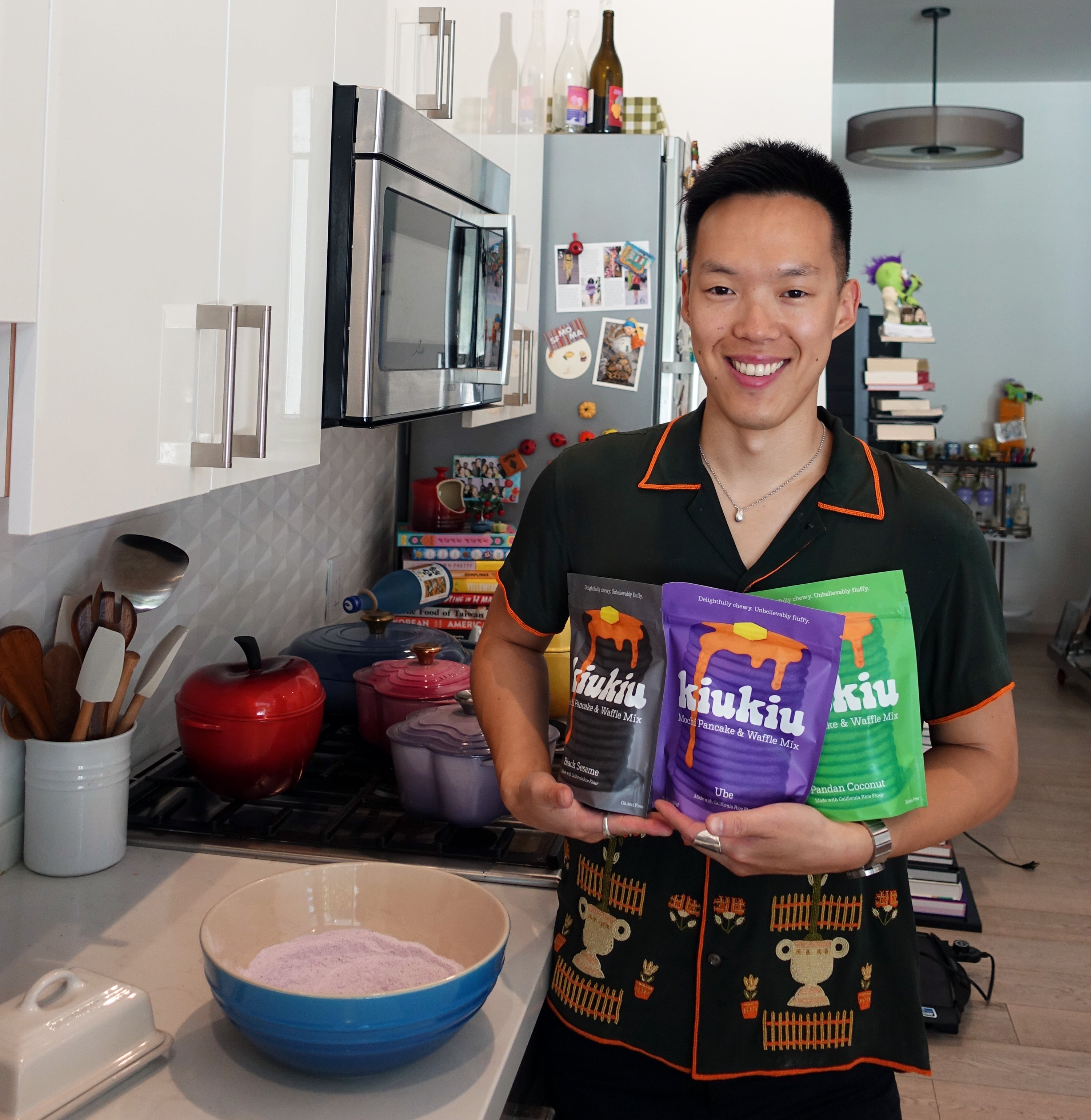 John Liu KiuKiu Founder holding bags of KiuKiu Mochi Pancake & Waffle Mix